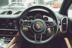 the interior of a car with a steering wheel and dashboard