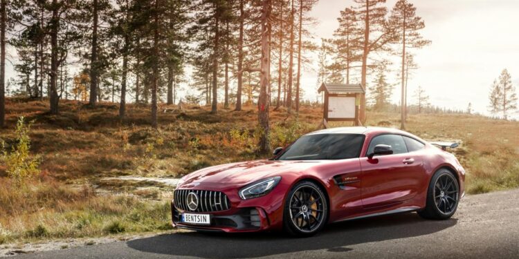 red Mercedes-Benz coupe on road